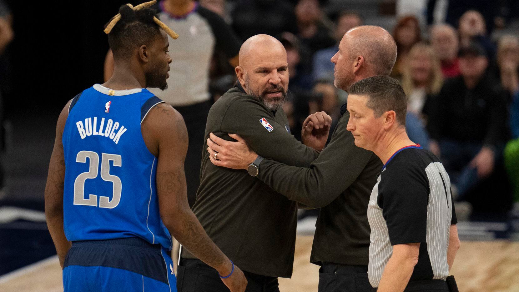 Dallas Mavericks head coach Jason Kidd, second from left, reacts after being ejected during...