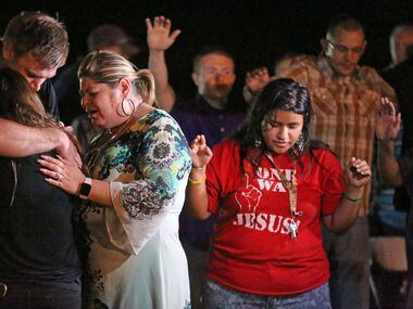 Emotions run high at a memorial service held at the baseball field in Sutherland Springs,...
