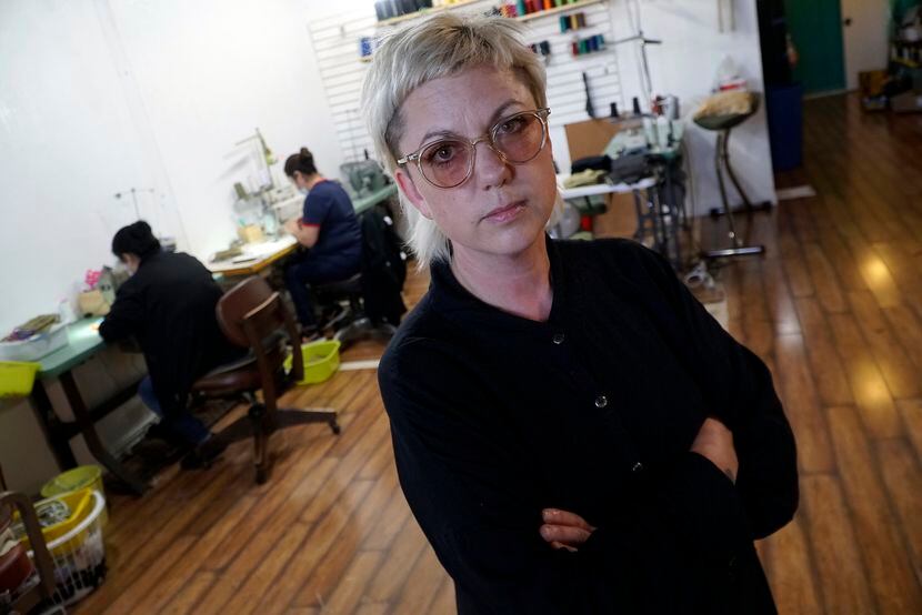 Oak Cliff fashion designer Julie McCullough and her staff are making face masks instead of...