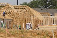 Workers remain on an under construction site of Silverado community on Wednesday, July 20,...