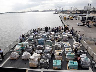 Pallets containing more than 26 tons of cocaine worth at least $715 million sit on the...