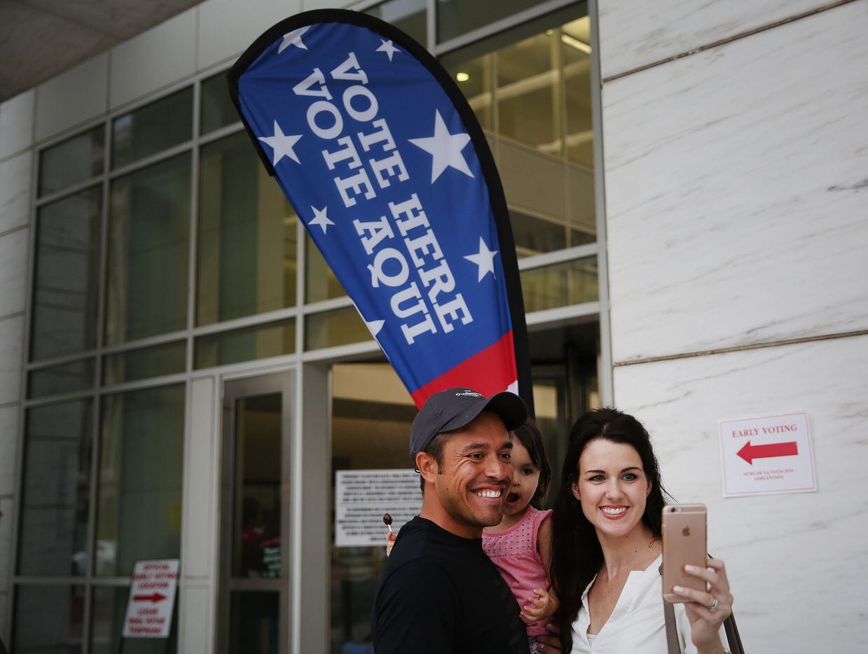 Carlos Aguirre and Melissa Aguirre, of Richardson, Texas, takes a selfie with their daughter Mia Aguirre, 2, after voting during early voting at the George L. Allen, Sr. Courts Building in downtown Dallas Friday November 4, 2016. November 4th was the last day for early voting in Dallas County. 
