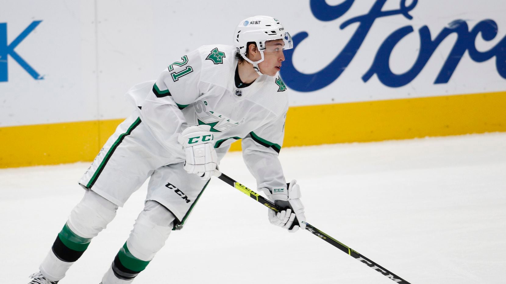 Dallas Stars' Jason Robertson (21) controls the puck during first period play against the Detroit Red Wings. The two teams played their NHL game at the American Airlines Center in Dallas on April 20, 2021.