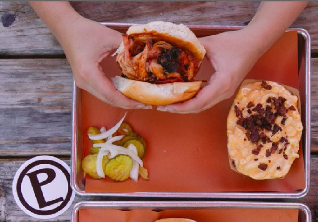Barbecue lovers can order up a Pecan Lodge brisket sandwich with a side mac and cheese...