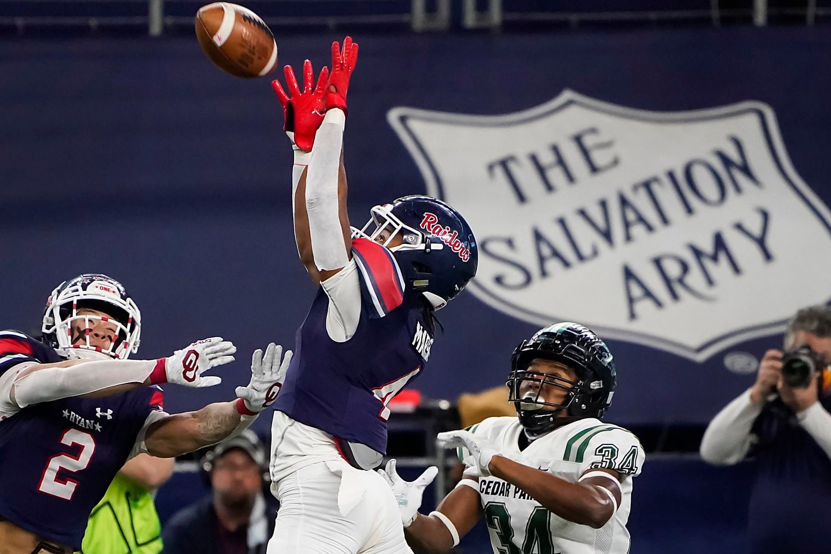 Denton Ryan defensive back Ty Marsh (4) intercepts a pass intended for Cedar Park wide receiver Josh Cameron (34) during the first half of the Class 5A Division I state football championship game at AT&T Stadium on Friday, Jan. 15, 2021, in Arlington, Texas. (Smiley N. Pool/The Dallas Morning News)