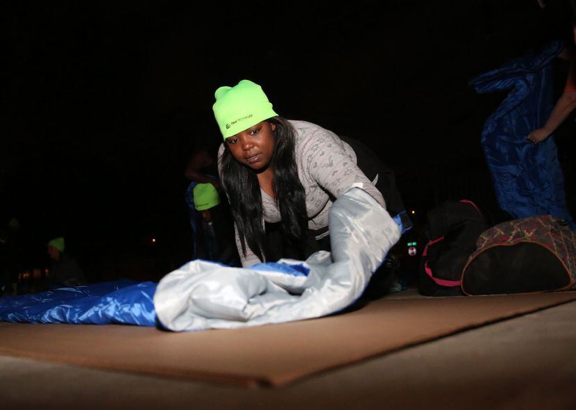 Kimberly Jenkins lays out her sleeping bag during the Promise House Sleep Out. (Rose...