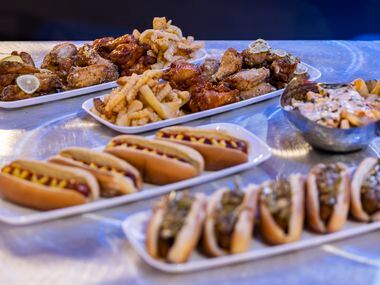 A sampling of food, including hot dogs and seasoned chicken wings, available for purchase at...