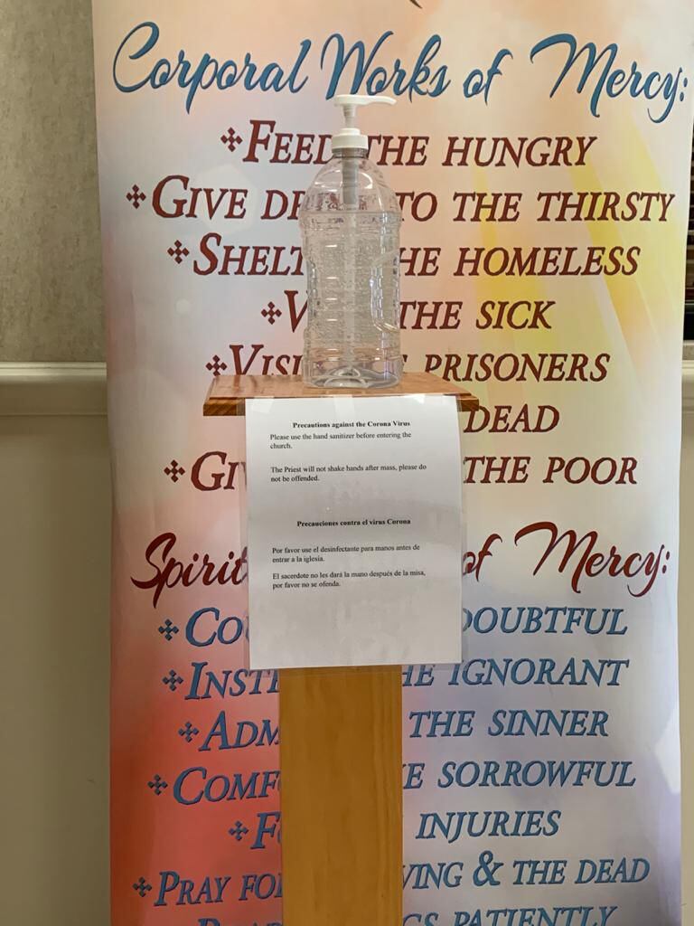 A bottle of hand sanitizer at the entrance of a Mesquite church.