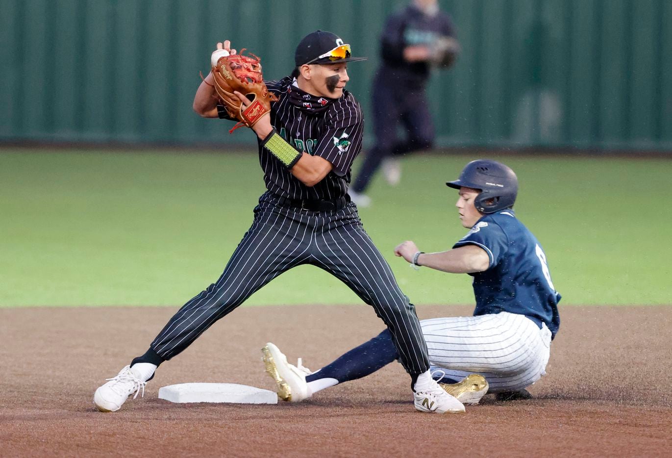 Southlake’s Ethan Mendoza forces out Keller’s Griffin Barton (6) during the fourth inning of their Class District 4-6A baseball game in Souhtlake, Texas on March 19, 2021. (Michael Ainsworth/Special Contributor)