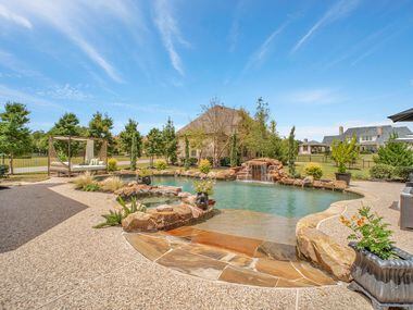 Situated on more than an acre in the Prosper neighborhood of Whispering Farms, this 2005...