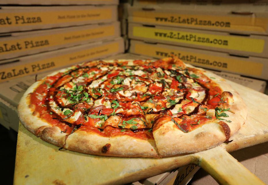 Zalat's first-of-its-kind food stall, Slices, serves slices of pizza inside the Exchange...