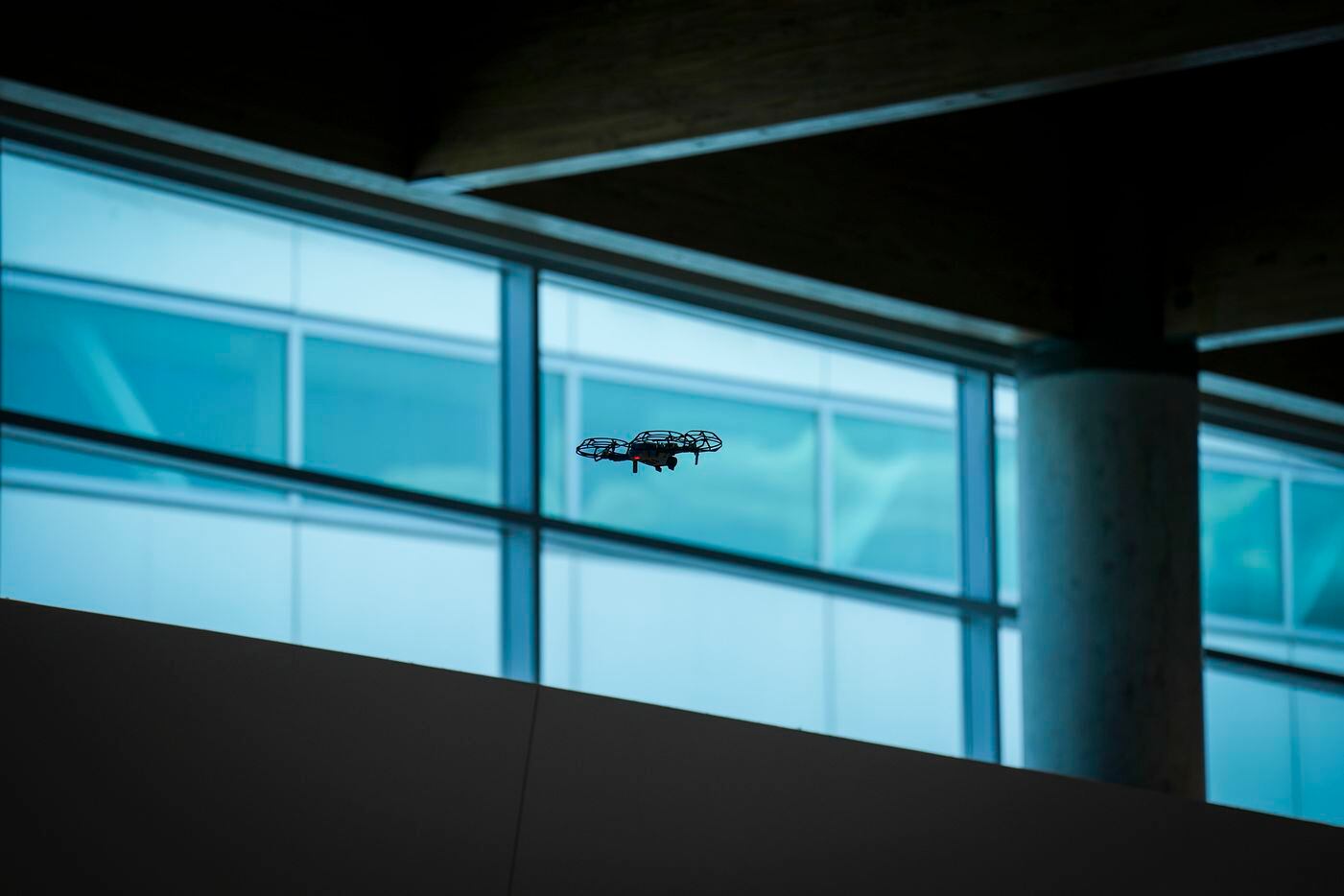 Investigators use a drone inside the ticketing hall at Dallas Love Field Airport on Monday,...