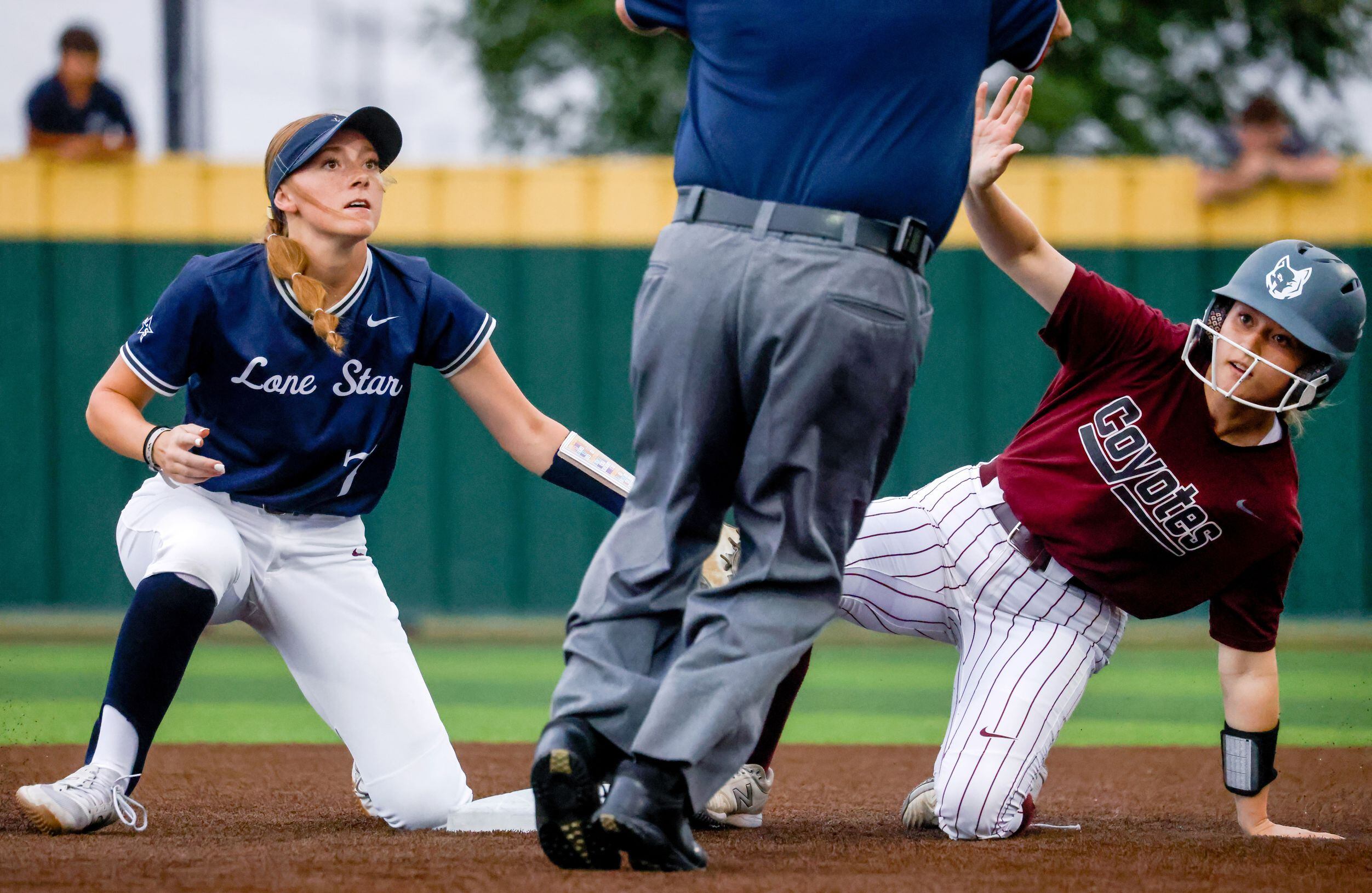 Frisco Lone Star second baseman Emma Zaboronek (7) looks up at an umpire after attempting to...