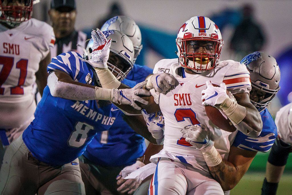 SMU running back Ke'Mon Freeman (2) is brought down by the Memphis defense during the second...