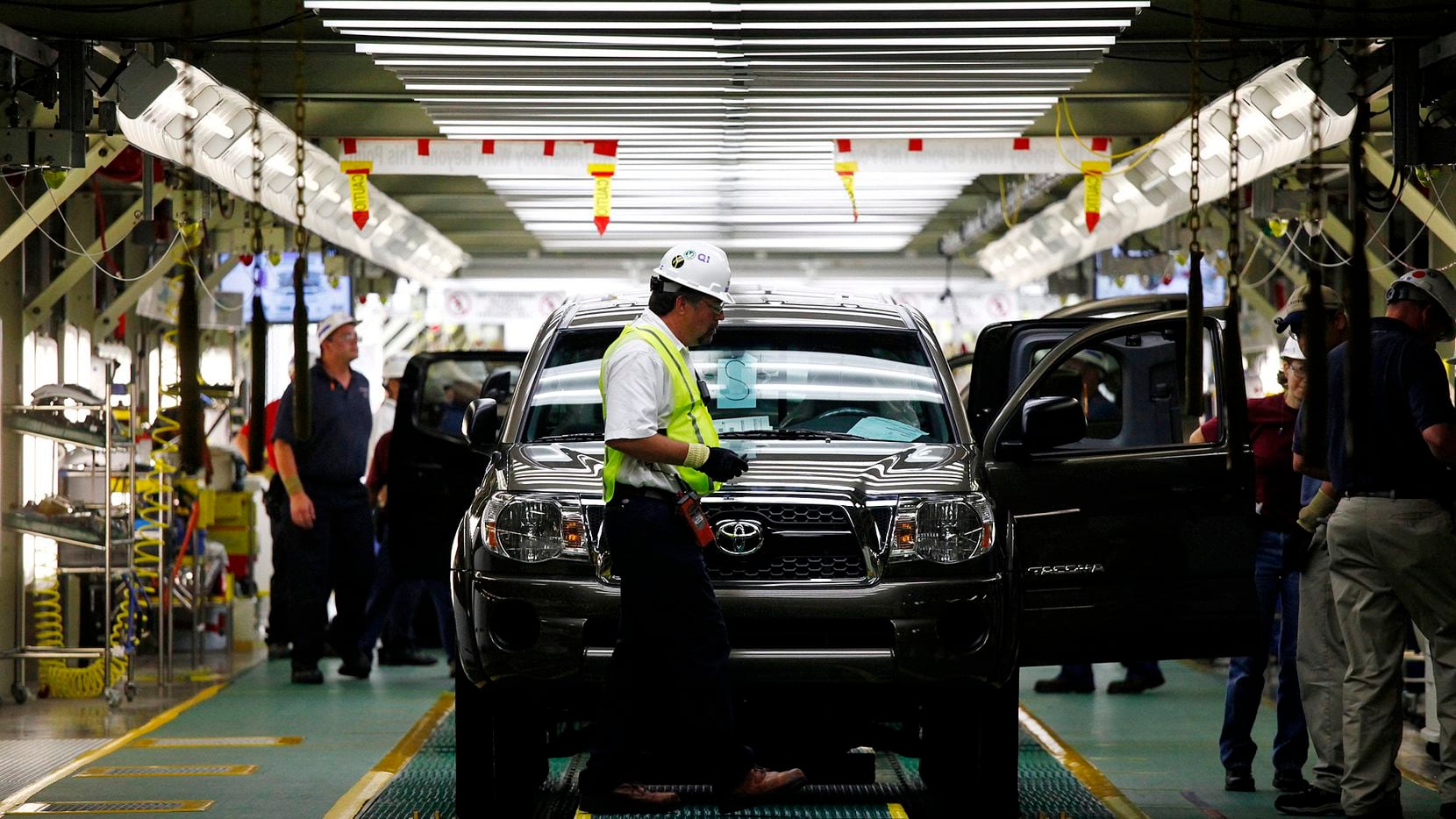 A Toyota Tacoma truck waits to come off the final inspection line at the Toyota...