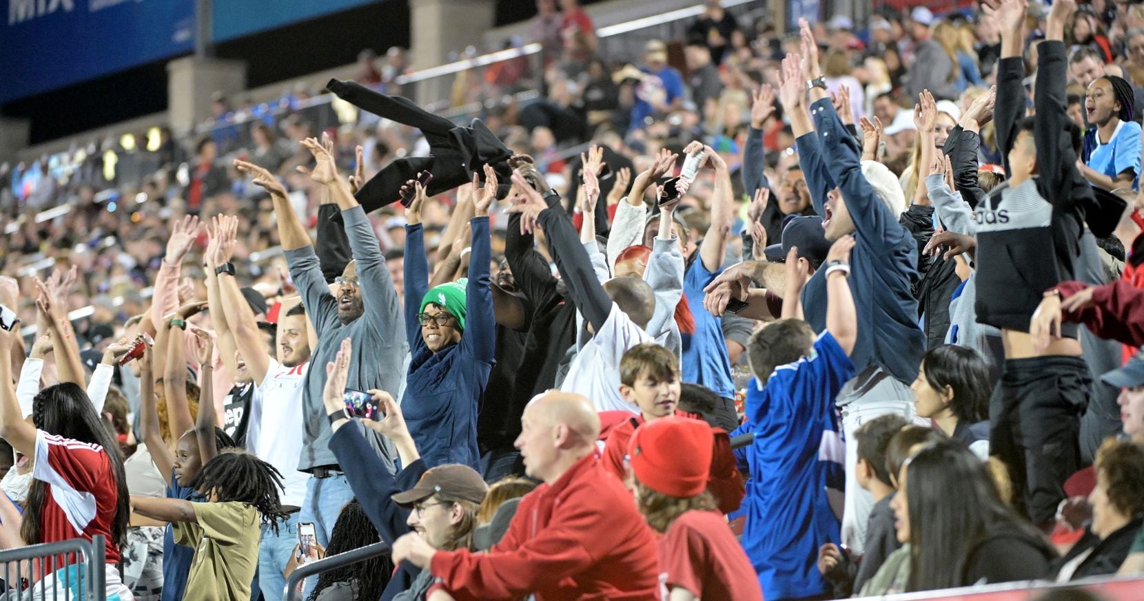 FC Dallas fans do the wave in the second half during a MLS soccer game between the Portland...