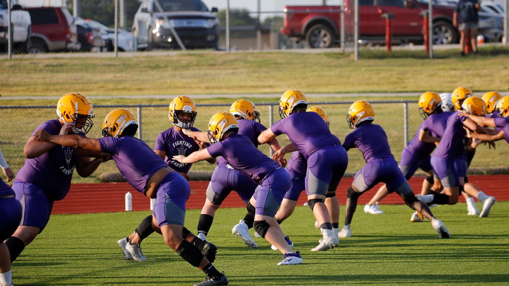 Linesmen run through a drill during the first day of high school football practice for 4A's Farmersville High School in Farmersville, Texas on Monday, August 3, 2020.