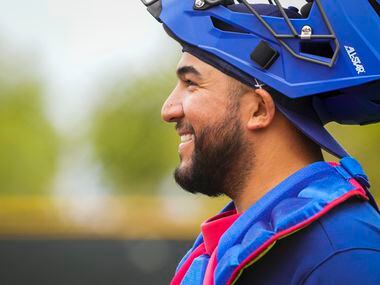 Texas Rangers catcher Jose Trevino smiles after the end of an inning during a “B” game on...