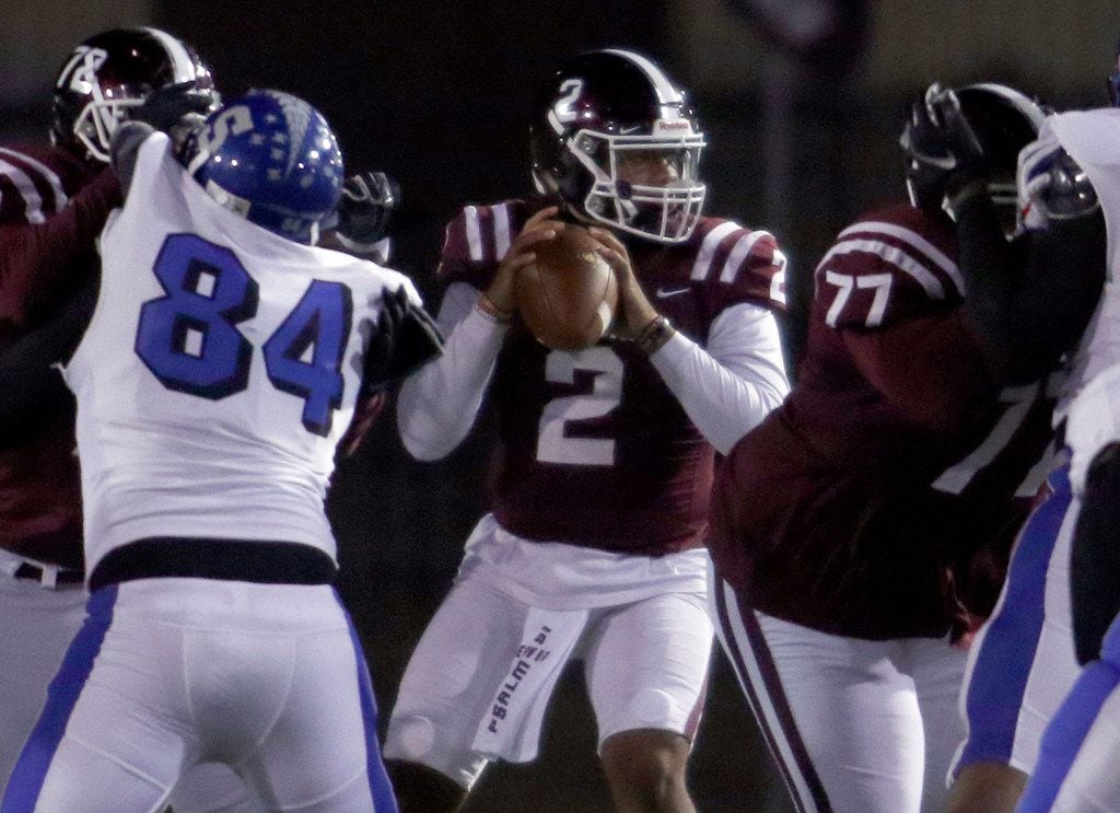 Red Oak quarterback Joshua Ervin (2) looks to pass behind good protection during first half...