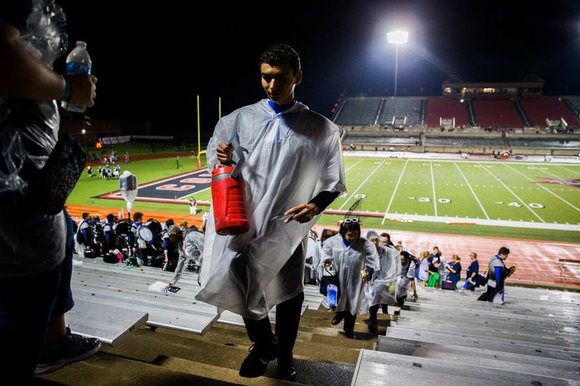 Allen band members evacuate the stadium for a lightning delay just before the third quarter...