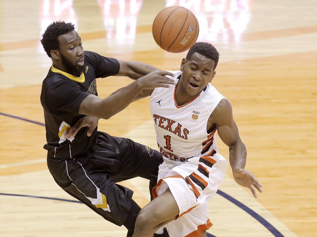 UTEP’s Dominic Artis collides with Southern Mississippi guard Khari Price during the first...