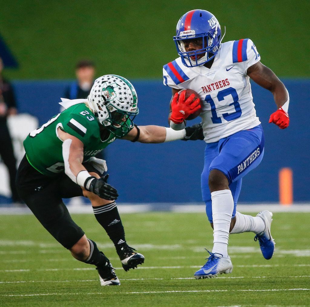 Duncanville wide receiver Roderick Daniels (13) makes a break past Southlake Carroll defensive back Beck Para (23) during the second half of a Class 6A Division I Region I high school football matchup between Southlake Carroll and Duncanville on Saturday, Dec. 7, 2019 at McKinney ISD Stadium in McKinney, Texas. (Ryan Michalesko/The Dallas Morning News)