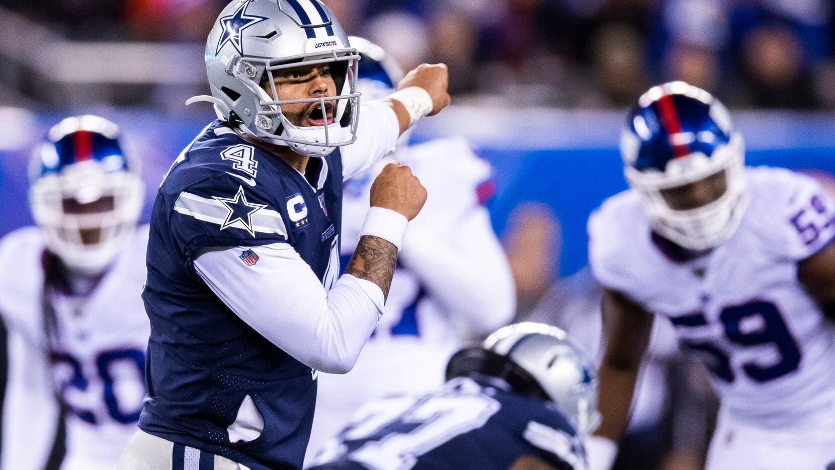 Dallas Cowboys quarterback Dak Prescott (4) shouts a play during the fourth quarter of an...