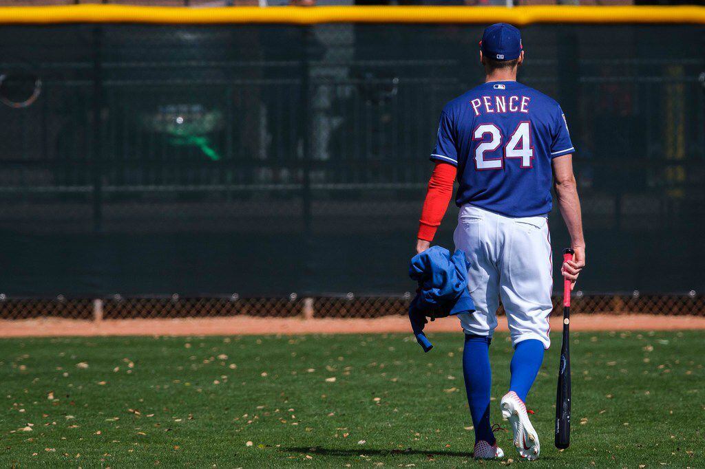 Texas Rangers outfielder Hunter Pence heads for the clubhouse following the first full squad...