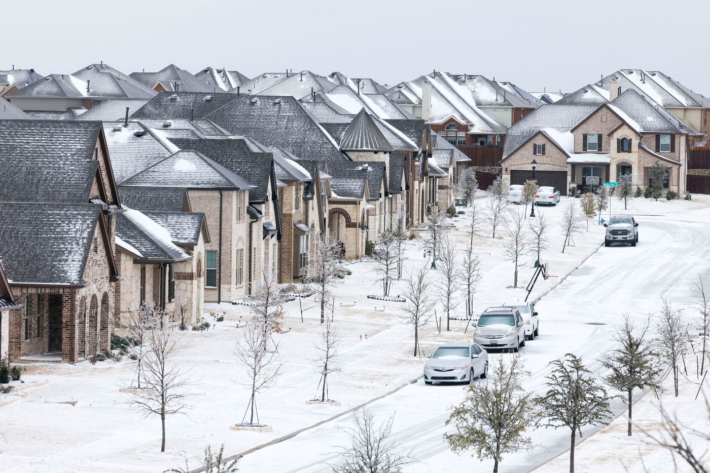 A neighborhood in Little Elm, Tx covered with snow is visible after a snowstorm on Thursday,...