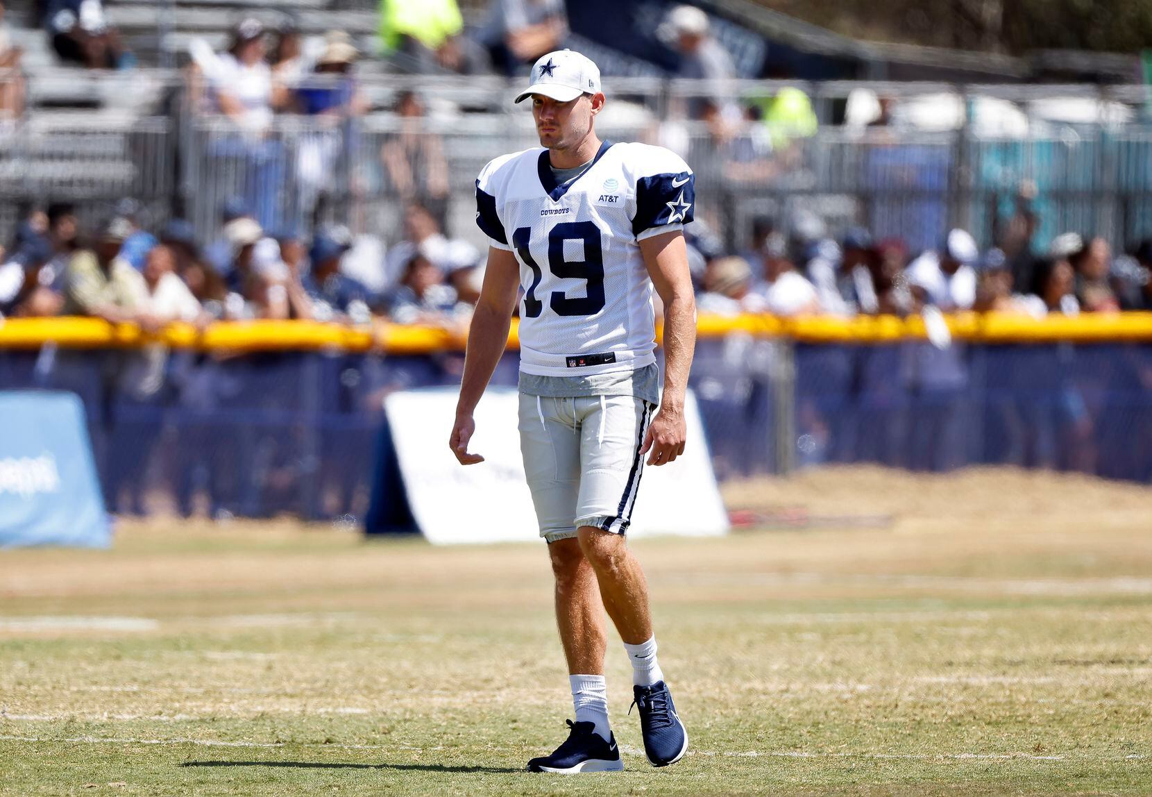 Dallas Cowboys newly singed kicker Brett Maher (19) walks around the field during training...