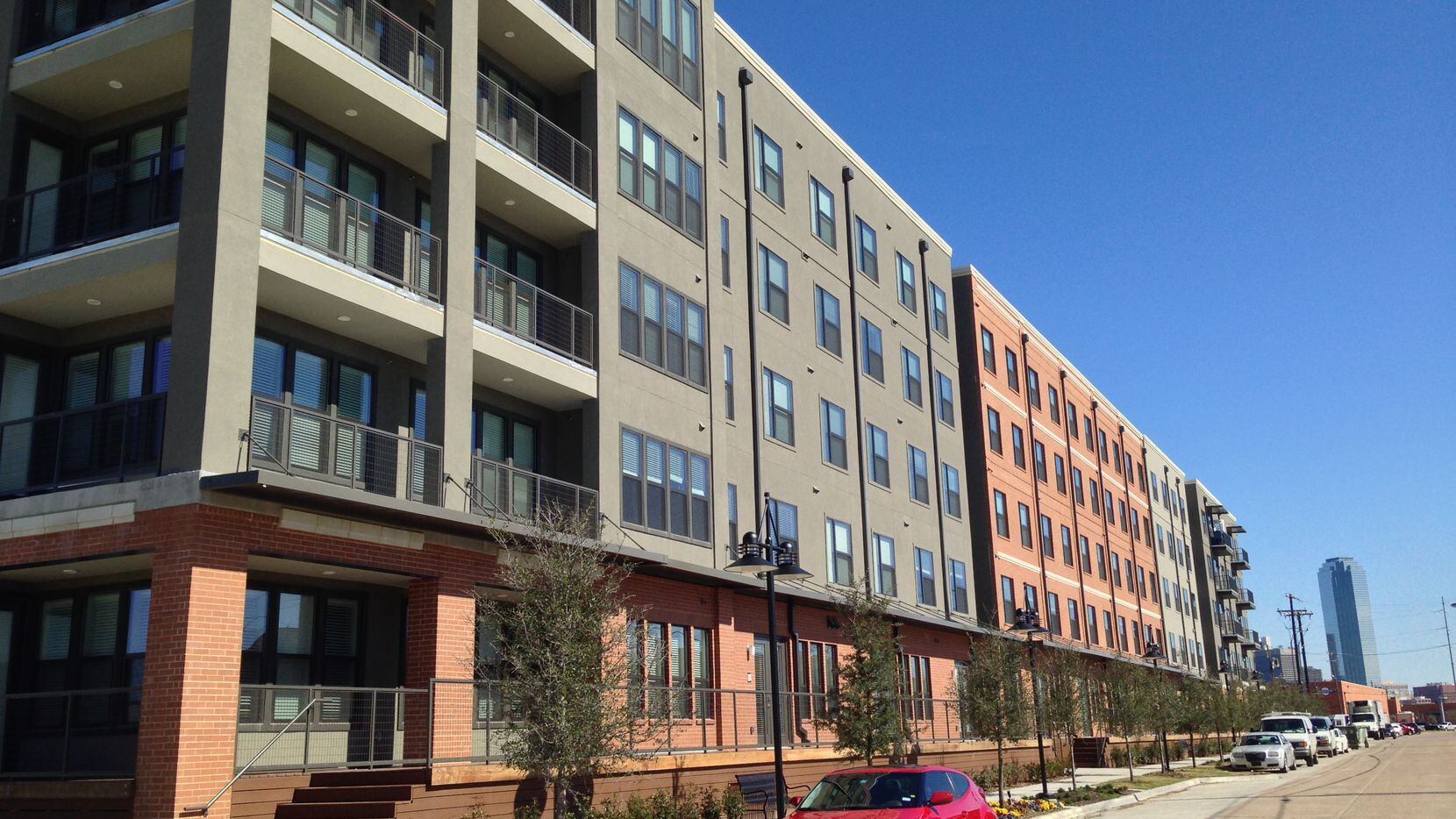 The new Alexan Riveredge apartments are on Levee Street on the banks of the Trinity River.