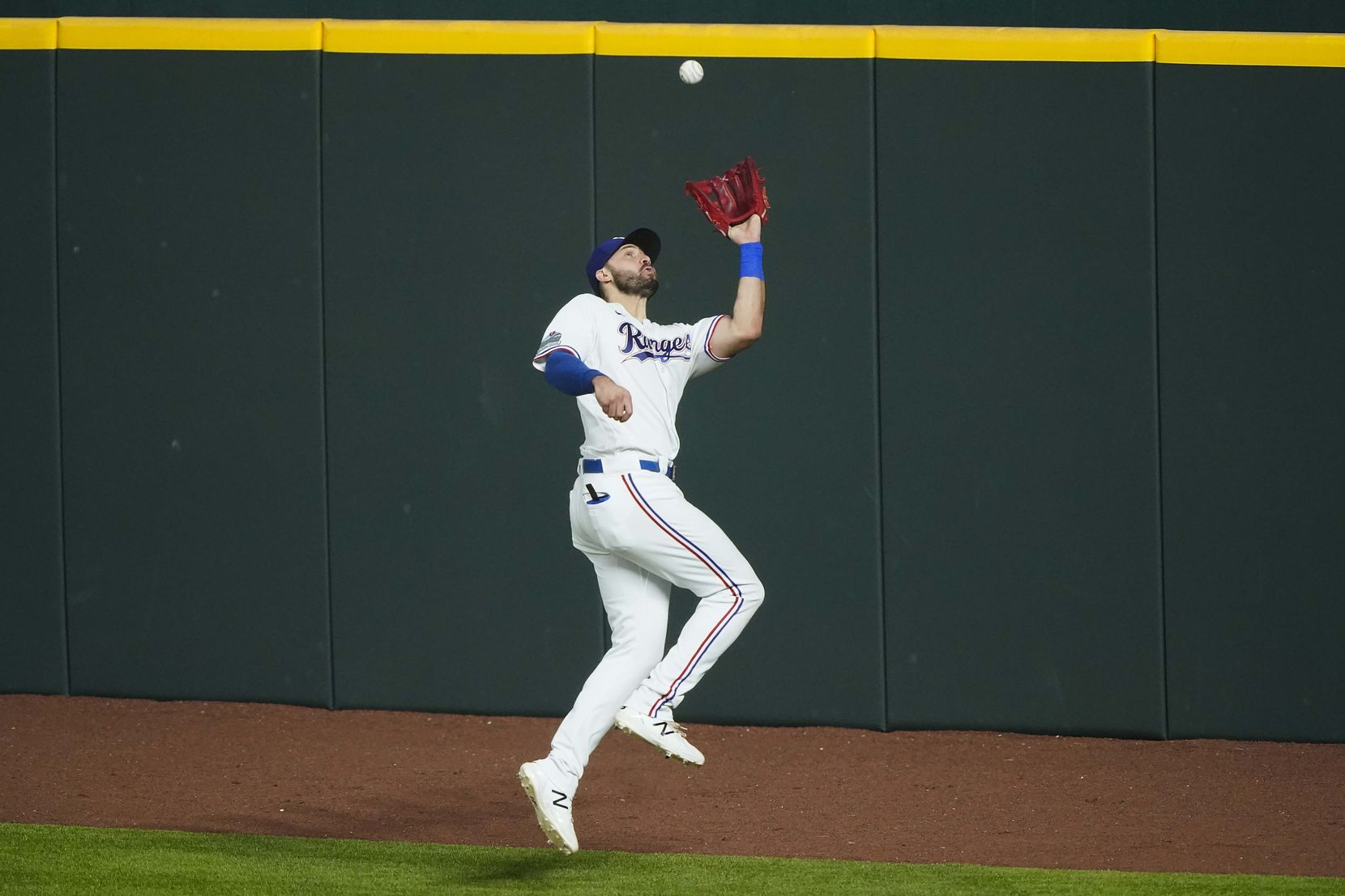 Outfielder Joey Gallo makes a leaping catch on the warning track in an intrasquad game...