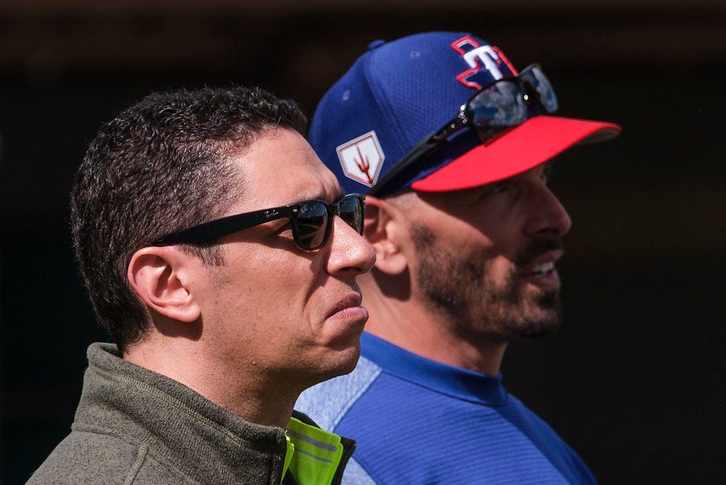 Texas Rangers general manager Jon Daniels (left) and manager Chris Woodward have some...