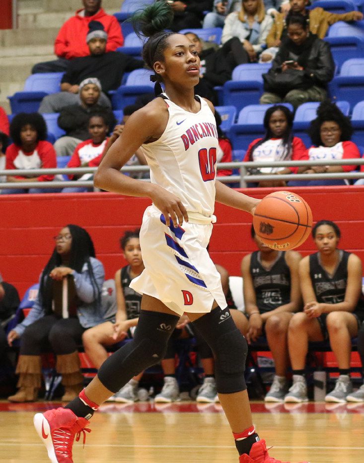 Duncanville guard Zarielle Green (00) looks to set up an offensive play during first half...
