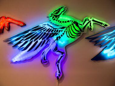 Michael McPheeters' work at Psychedelic Robot depicts pegasus statues that light up from the...