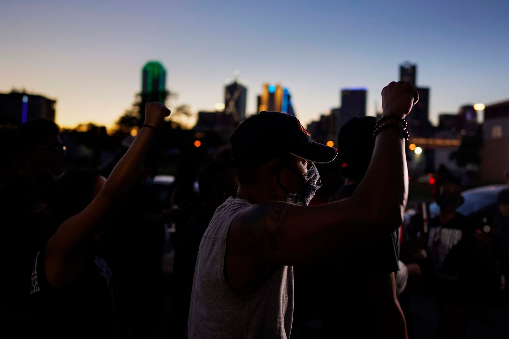 Protesters march against police brutality as they depart a rally at the Dallas Police...