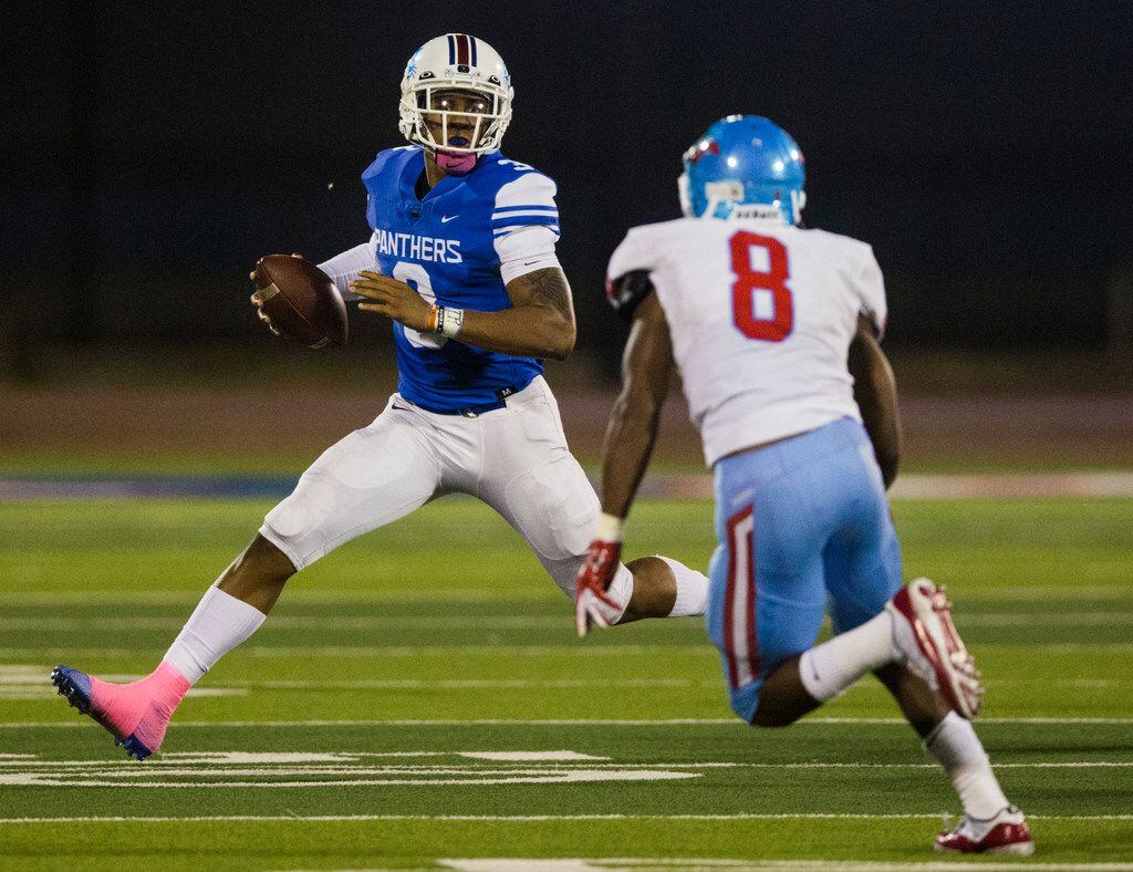 Duncanville quarterback Ja'Quinden (3) runs the ball against Skyline linebacker Javius Williams (8) during the second quarter of a high school football game between Skyline and Duncanville on Friday, October 4, 2019 at Panther Stadium in Duncanville.