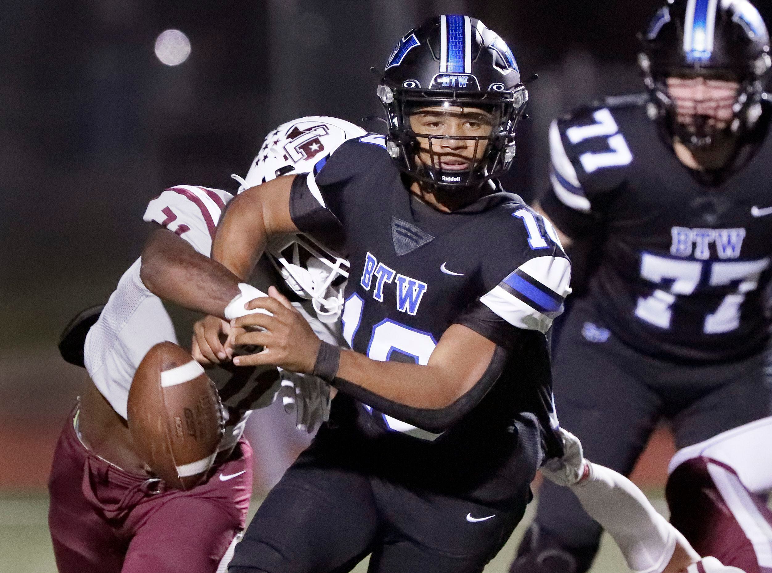 Lewisville High School running back Viron Ellison (21) causes Hebron High School quarterback...