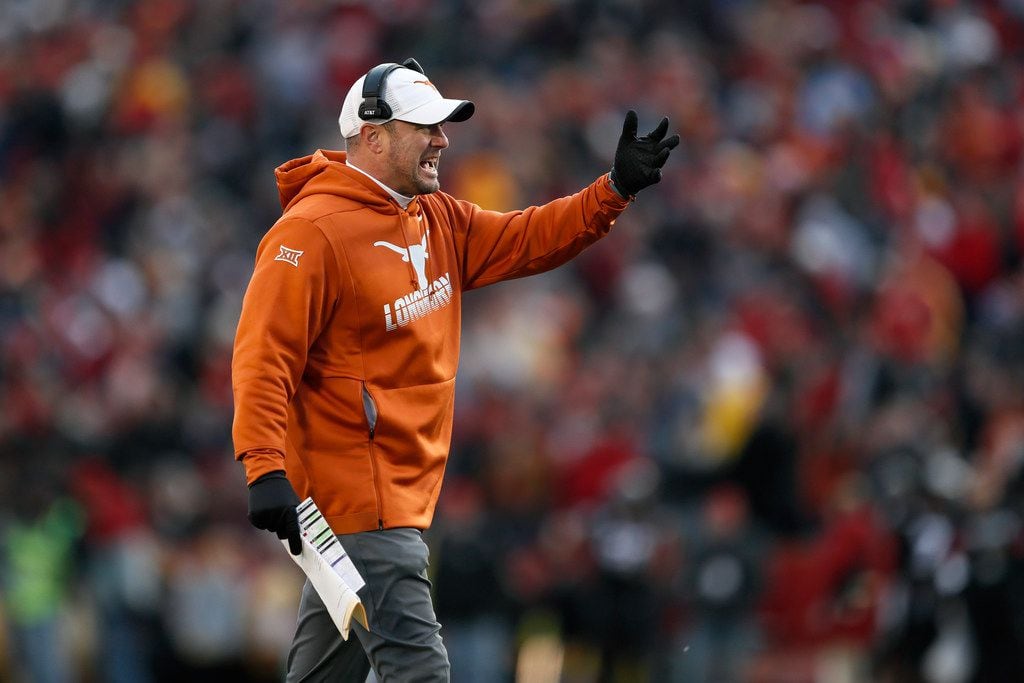 Texas head coach Tom Herman questions a call against his team during the first half of an...