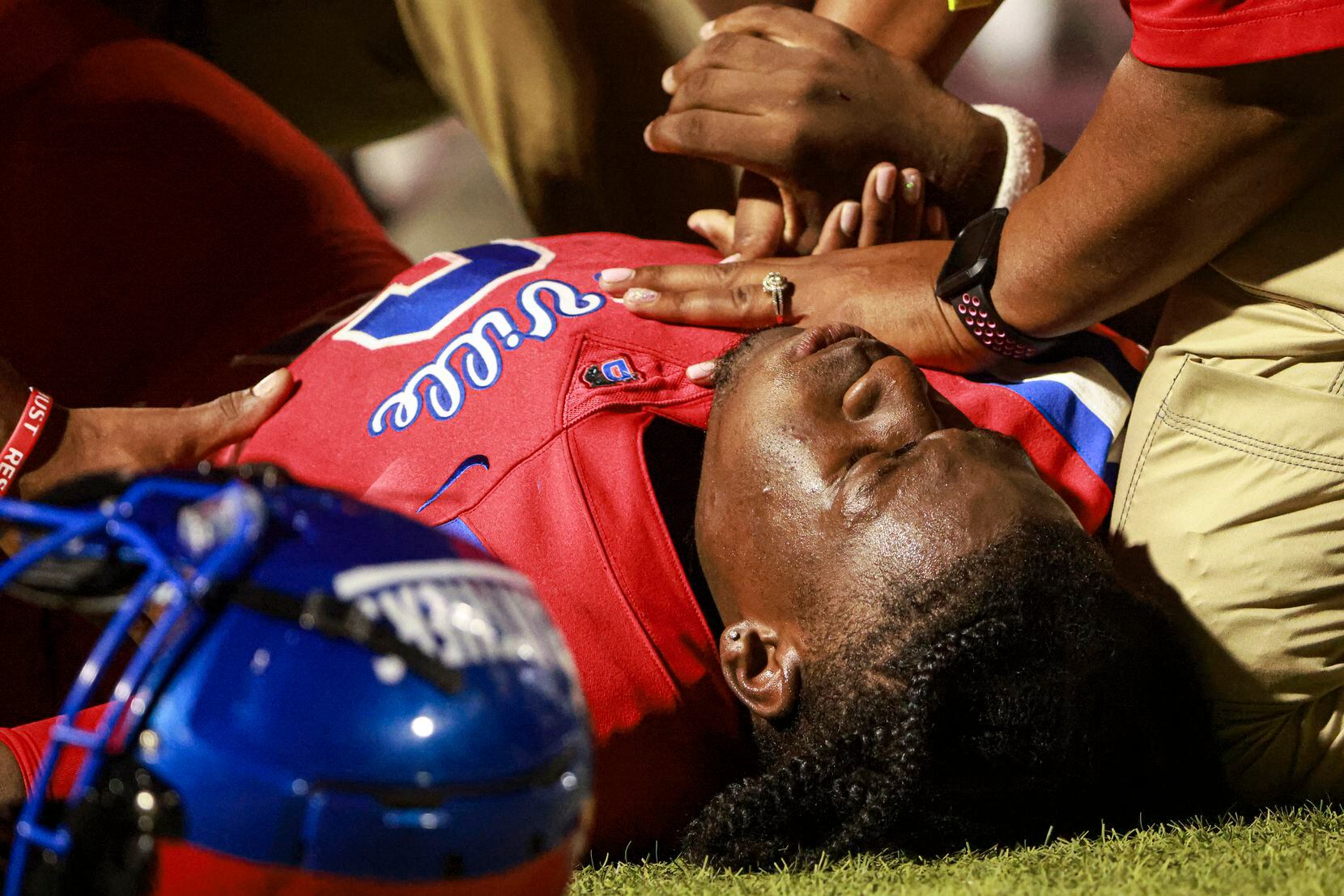 Duncanville High School Da'Myrion Coleman (6) lays on the side of the field injured in the...