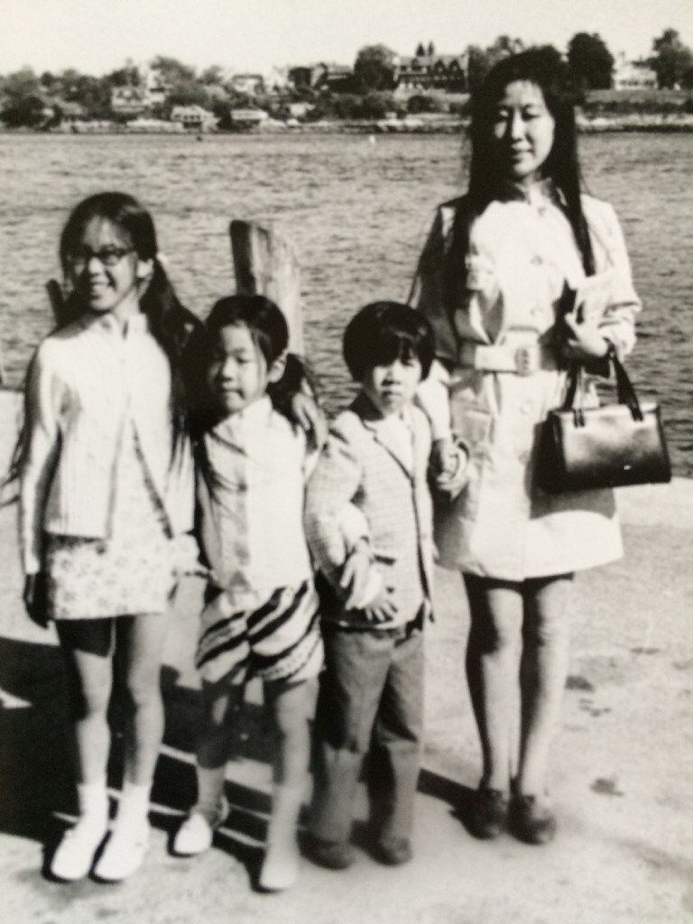 Thomas Huang clutches his mother's hand, his right arm is entwined with his sister's. Decades later, it is the children who must slow down so their mother can keep up. 