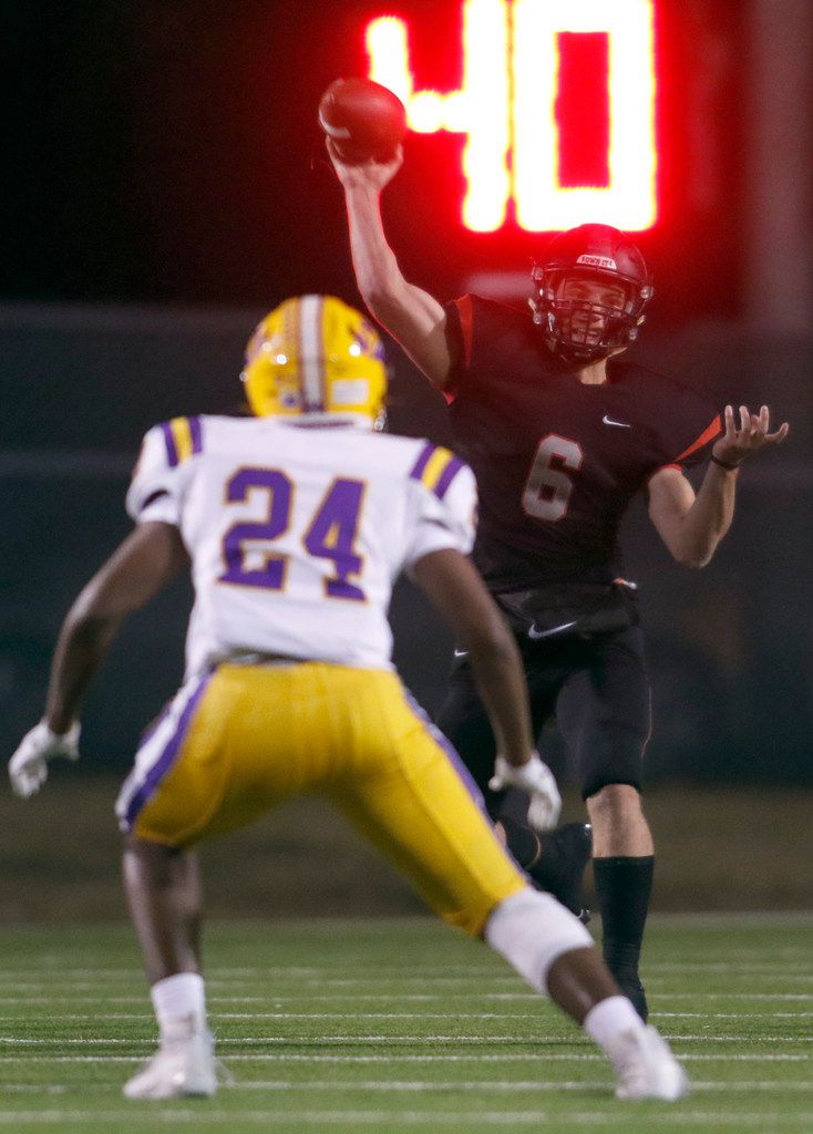 Lake Highlands quarterback Mitch Coulson (6) launches a pass beyond the reach of Richardson...