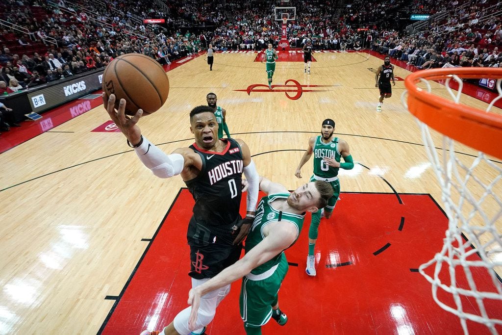 Houston Rockets' Russell Westbrook (0) goes up for a shot as Boston Celtics' Gordon Hayward...