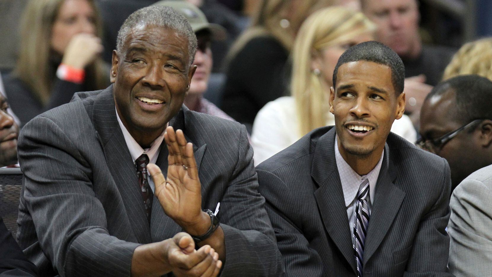 Charlotte Bobcats head coach Paul Silas and his son and assistant coach Stephen Silas react...