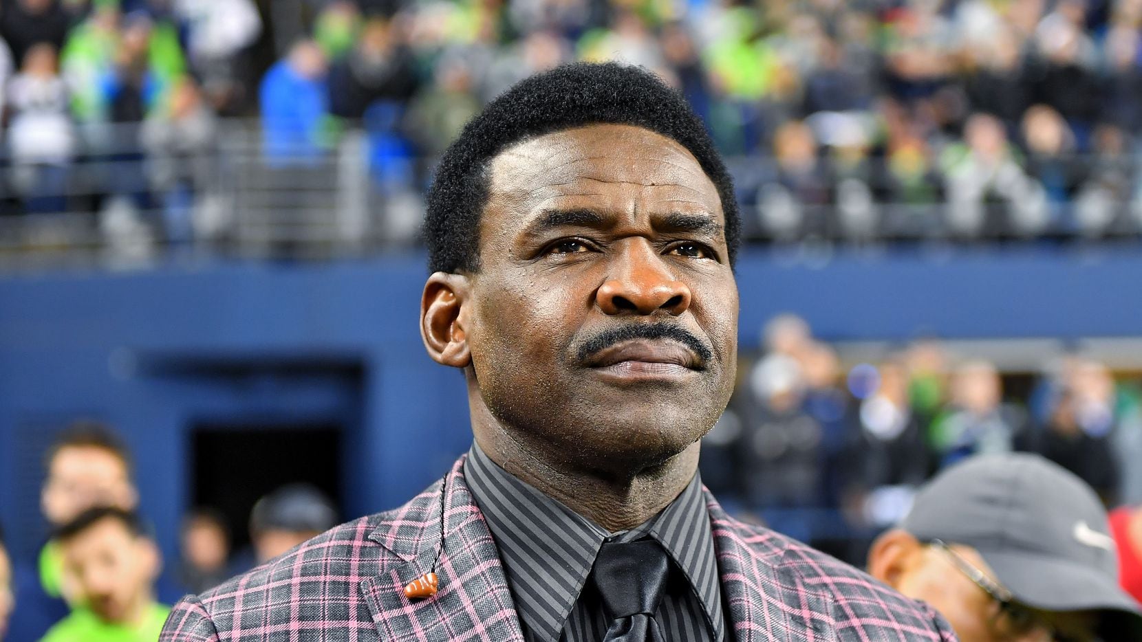 FILE — HOF wide receiver Michael Irvin of the Dallas Cowboys pictured watching a game at CenturyLink Field on October 03, 2019 in Seattle, Washington.
