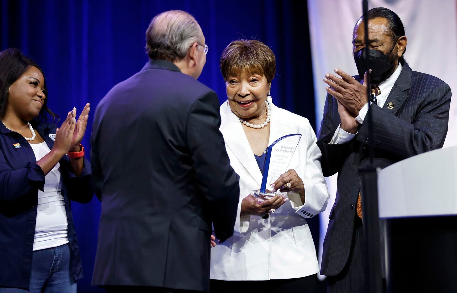 Outgoing U.S. Representative Eddie Bernice Johnson of Dallas (center) is recognized with the...