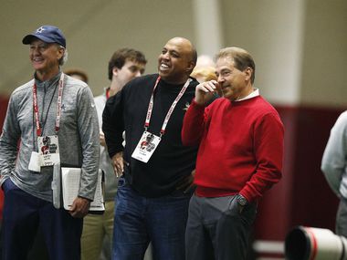 Dallas Cowboys scout Walter Juliff (left) and defensive assistant George Edwards (center) talk with Alabama head coach Nick Saban during Alabama's Pro Day on Wednesday, March 7, 2018 in Tuscaloosa, Ala.