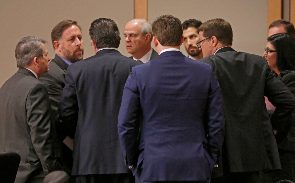 A defense team for Texas Attorney General Ken Paxton gathers during a break at Collin County...