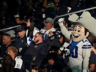 Dallas Cowboys mascot Rowdy tries to fire up the crowd before an NFL preseason football game...