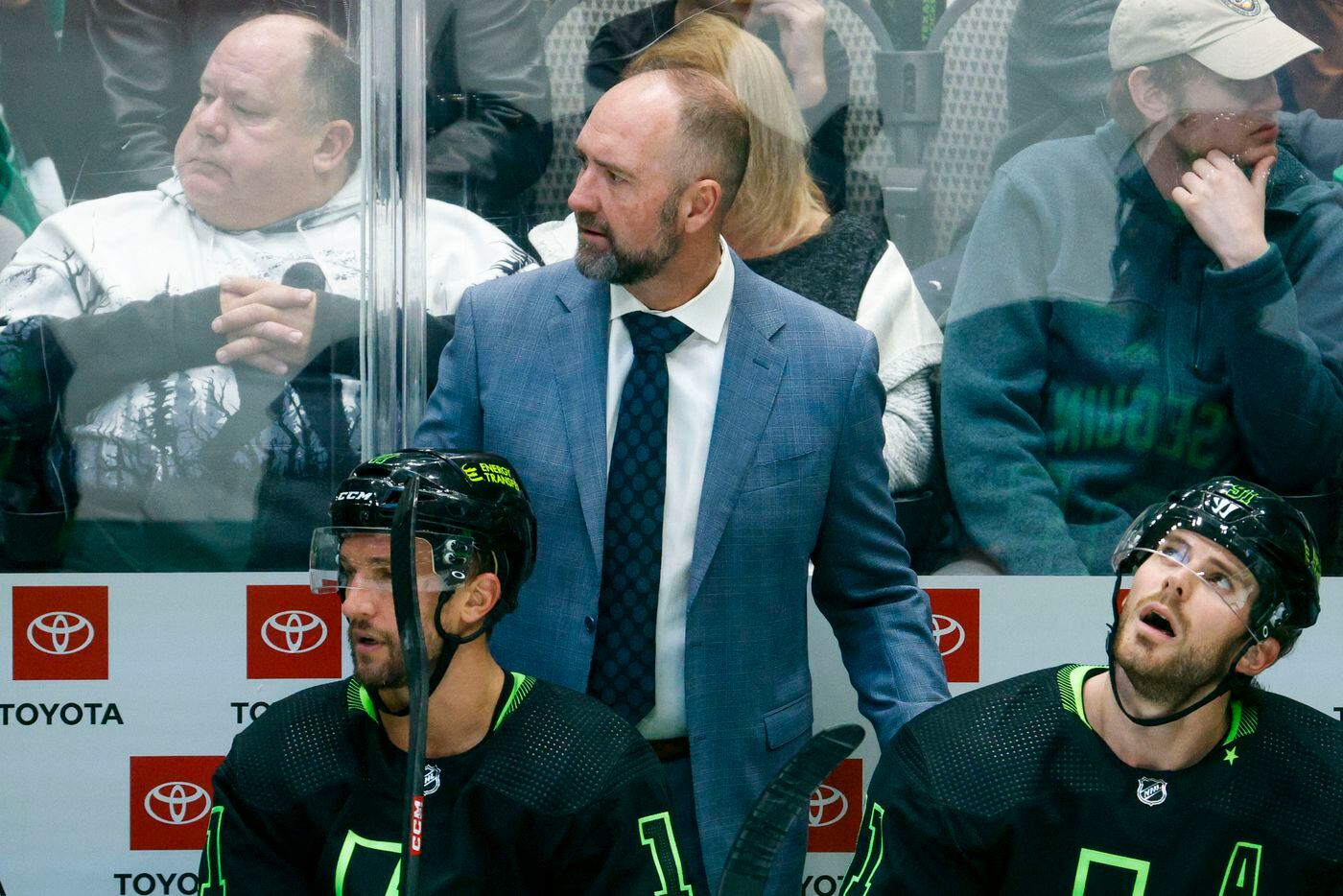 Dallas Stars head coach Peter DeBoer stands on the bench during the second period of an NHL...